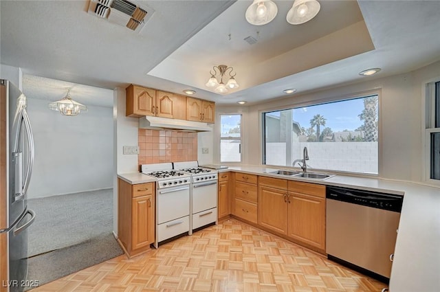 3143 El Chico Ct, Las Vegas, NV 89120 - kitchen with appliances with stainless steel finishes, a sink, a chandelier, under cabinet range hood, and backsplash