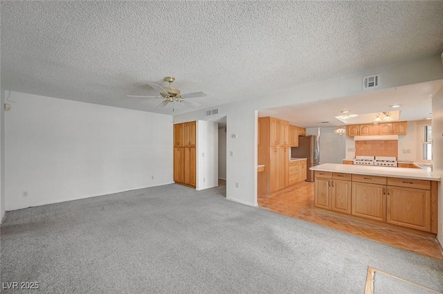 3143 El Chico Ct, Las Vegas, NV 89120 - unfurnished living room featuring light carpet, ceiling fan, and a textured ceiling