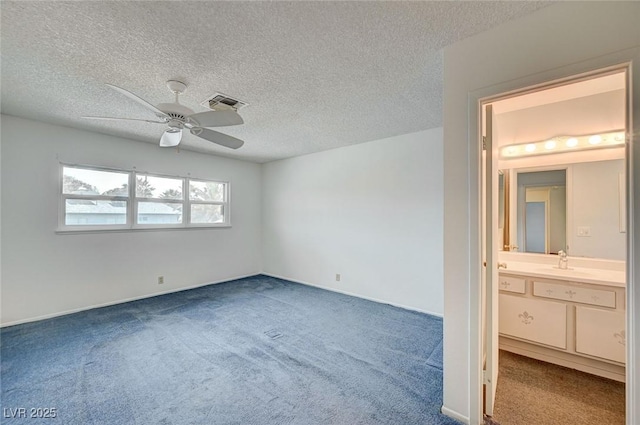 3143 El Chico Ct, Las Vegas, NV 89120 - unfurnished bedroom featuring a sink, carpet, a textured ceiling, a ceiling fan, and ensuite bathroom