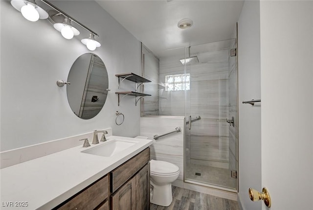 3143 El Chico Ct, Las Vegas, NV 89120 - bathroom with toilet, vanity, a stall shower, and wood finished floors