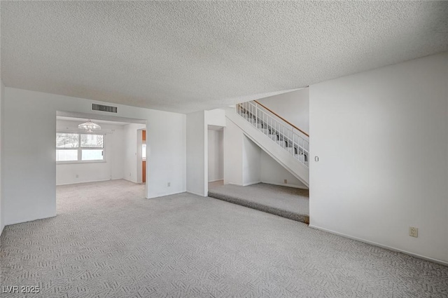 3143 El Chico Ct, Las Vegas, NV 89120 - carpeted empty room with stairs and a textured ceiling