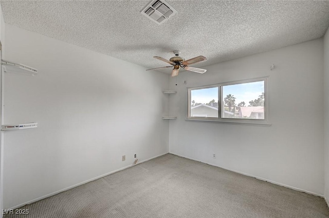 3143 El Chico Ct, Las Vegas, NV 89120 - empty room featuring a ceiling fan, light colored carpet, a textured ceiling, and baseboards