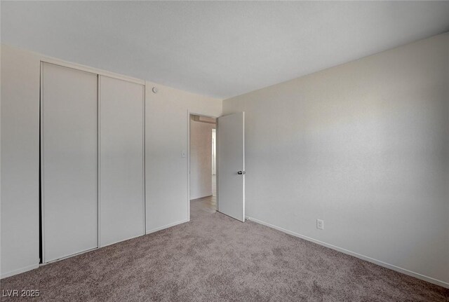 4496 Skyview Dr, Las Vegas, NV 89104 - unfurnished bedroom featuring carpet flooring, a closet, and baseboards