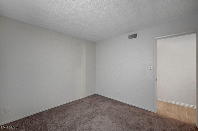 4496 Skyview Dr, Las Vegas, NV 89104 - carpeted empty room featuring a textured ceiling and baseboards