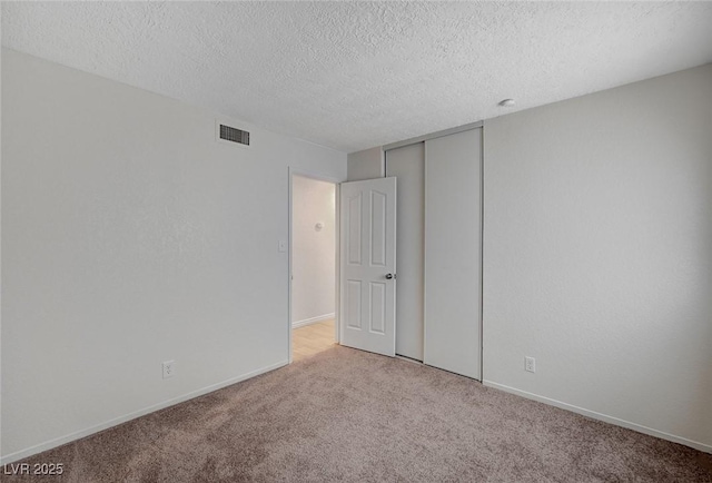 4496 Skyview Dr, Las Vegas, NV 89104 - spare room featuring carpet floors, a textured ceiling, and baseboards