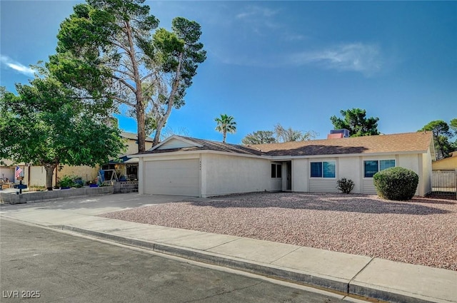 4496 Skyview Dr, Las Vegas, NV 89104 - ranch-style house with concrete driveway, a garage, and stucco siding