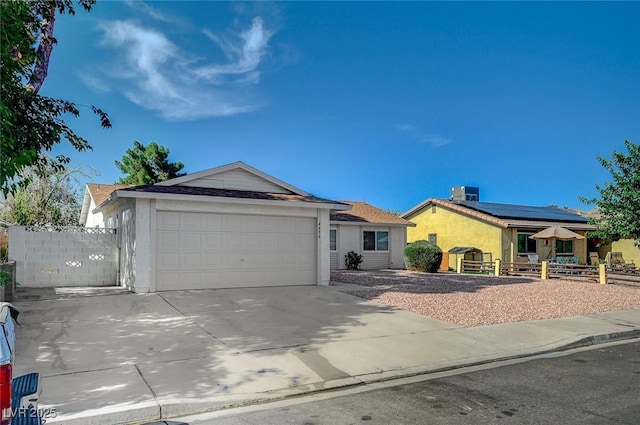 4496 Skyview Dr, Las Vegas, NV 89104 - ranch-style home featuring a garage, concrete driveway, stucco siding, and central AC unit