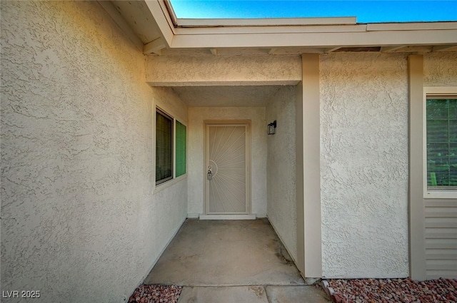 4496 Skyview Dr, Las Vegas, NV 89104 - doorway to property with stucco siding