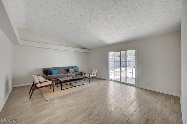 4496 Skyview Dr, Las Vegas, NV 89104 - living room with wood finished floors, vaulted ceiling, a textured ceiling, and baseboards