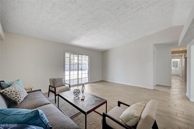 4496 Skyview Dr, Las Vegas, NV 89104 - living area featuring light wood-style floors, a textured ceiling, and baseboards
