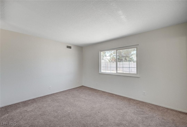 4496 Skyview Dr, Las Vegas, NV 89104 - spare room with carpet floors, a textured ceiling, and baseboards