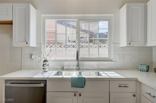 4496 Skyview Dr, Las Vegas, NV 89104 - kitchen with dishwasher, a sink, white cabinetry, and backsplash