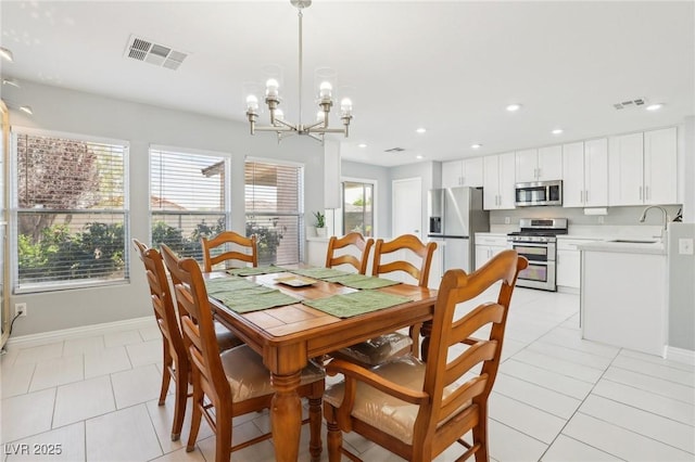 3966 Crystal Trip Ct, Las Vegas, NV 89129 - dining room featuring baseboards, recessed lighting, a chandelier, and light tile patterned floors