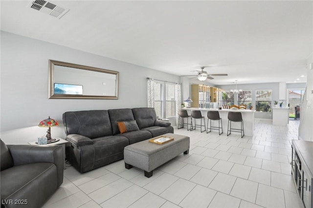 3966 Crystal Trip Ct, Las Vegas, NV 89129 - living area featuring a ceiling fan, plenty of natural light, and light tile patterned flooring