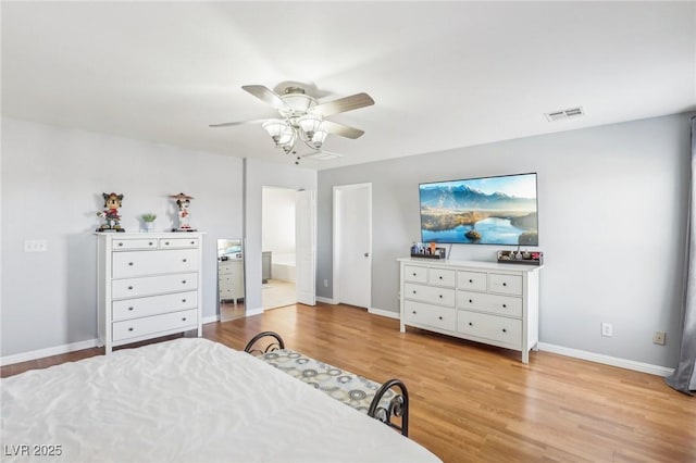 3966 Crystal Trip Ct, Las Vegas, NV 89129 - bedroom featuring wood finished floors, baseboards, ensuite bathroom, and ceiling fan