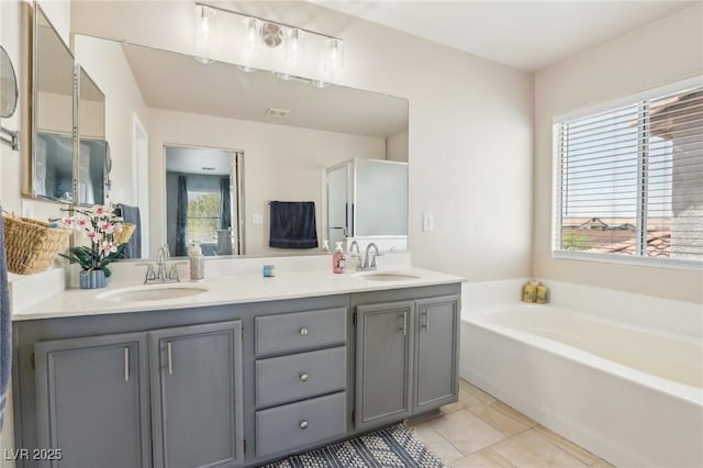3966 Crystal Trip Ct, Las Vegas, NV 89129 - full bath featuring double vanity, a bath, plenty of natural light, and tile patterned flooring