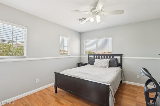 3966 Crystal Trip Ct, Las Vegas, NV 89129 - bedroom with wood finished floors, baseboards, and a ceiling fan