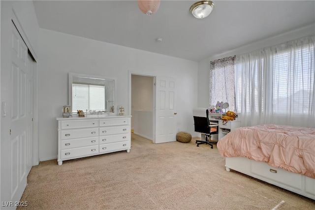 2851 Glistening Grove Ave, Henderson, NV 89052 - bedroom featuring light carpet, baseboards, and a closet