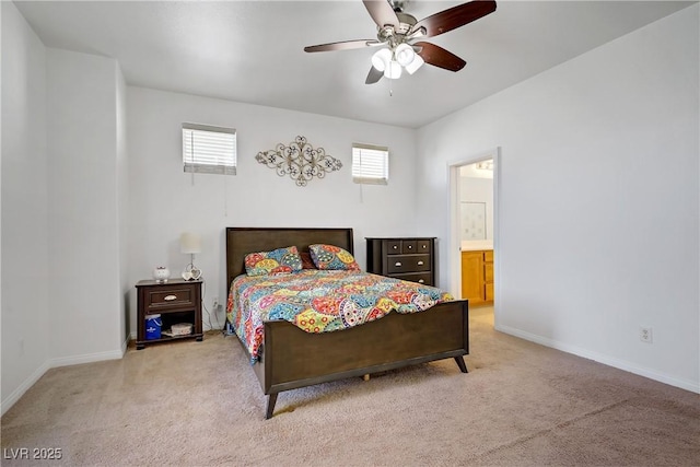 2851 Glistening Grove Ave, Henderson, NV 89052 - carpeted bedroom with baseboards, a ceiling fan, and connected bathroom