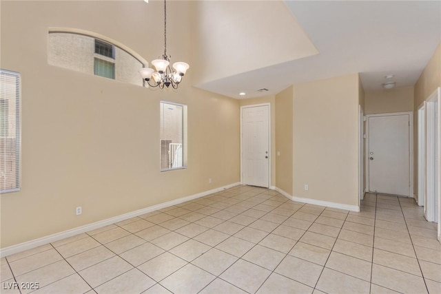 3037 Austin Pale Ave, North Las Vegas, NV 89081 - empty room featuring a chandelier, light tile patterned floors, and baseboards