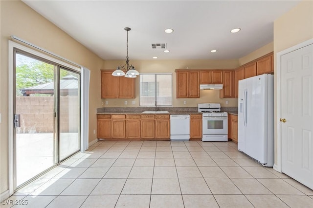 3037 Austin Pale Ave, North Las Vegas, NV 89081 - kitchen featuring white appliances, under cabinet range hood, a sink, light tile patterned flooring, and a chandelier