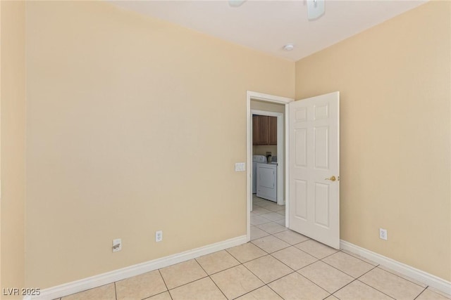 3037 Austin Pale Ave, North Las Vegas, NV 89081 - unfurnished room featuring washing machine and clothes dryer, light tile patterned floors, baseboards, and a ceiling fan