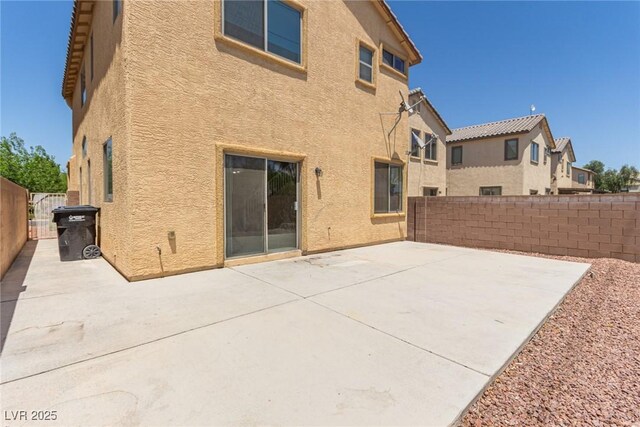 3037 Austin Pale Ave, North Las Vegas, NV 89081 - back of property featuring stucco siding and a patio