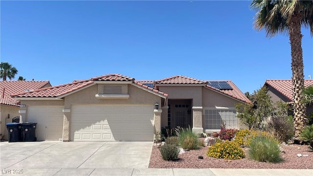 1128 Galangate Ave, Henderson, NV 89015 - mediterranean / spanish-style house featuring stucco siding, an attached garage, and concrete driveway