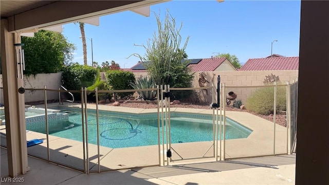 1128 Galangate Ave, Henderson, NV 89015 - view of pool with a fenced backyard, a pool with connected hot tub, and a patio area