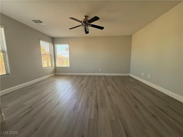 258 Bella Matese Ave, Las Vegas, NV 89183 - empty room featuring a ceiling fan, baseboards, and dark wood-type flooring