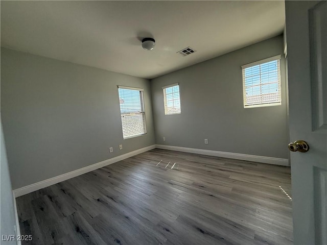 258 Bella Matese Ave, Las Vegas, NV 89183 - empty room featuring baseboards and wood finished floors
