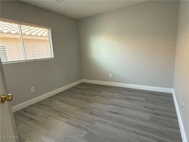 258 Bella Matese Ave, Las Vegas, NV 89183 - empty room featuring wood finished floors and baseboards