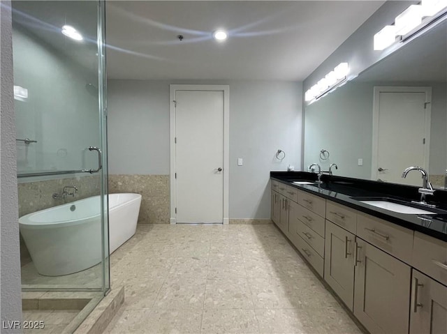 4525 Dean Martin Dr Unit 1507, Las Vegas, NV 89103 - bathroom with double vanity, a freestanding tub, a stall shower, and tile patterned flooring