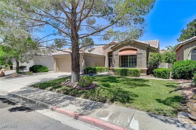 9220 Evergreen Canyon Dr, Las Vegas, NV 89134 - view of front facade with a tiled roof, stucco siding, a front yard, driveway, and an attached garage