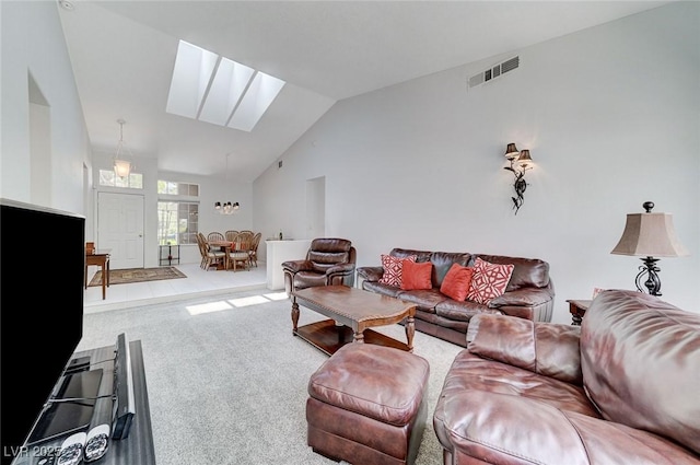 9220 Evergreen Canyon Dr, Las Vegas, NV 89134 - living area featuring vaulted ceiling, a skylight, and carpet