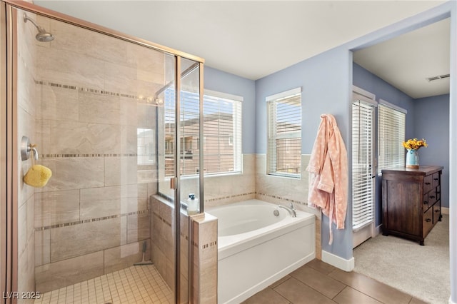 3159 Via Como, Henderson, NV 89044 - bathroom with a bath, tile patterned floors, a shower stall, and baseboards