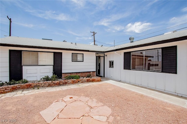 6301 Garwood Ave, Las Vegas, NV 89107 - ranch-style house featuring board and batten siding and a patio area