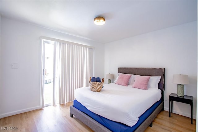 6301 Garwood Ave, Las Vegas, NV 89107 - bedroom featuring wood finished floors and baseboards