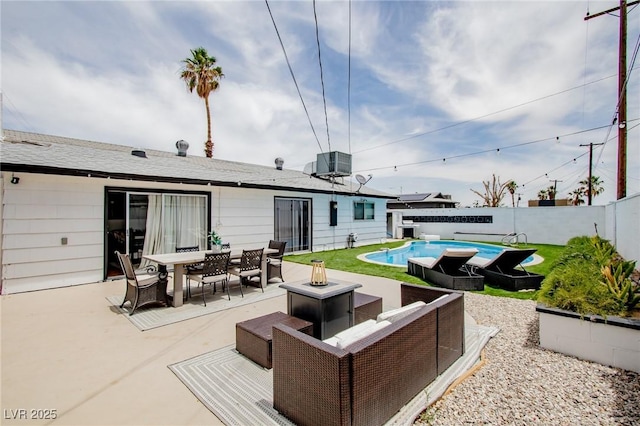 6301 Garwood Ave, Las Vegas, NV 89107 - fenced backyard featuring an outdoor fire pit, outdoor dining area, and a patio