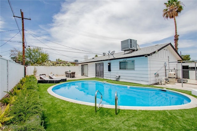 6301 Garwood Ave, Las Vegas, NV 89107 - view of swimming pool with central air condition unit and a patio