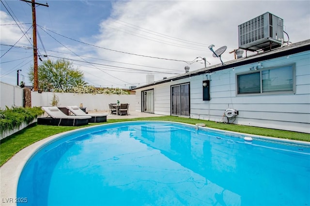 6301 Garwood Ave, Las Vegas, NV 89107 - view of swimming pool featuring cooling unit, a patio, and an outdoor living space