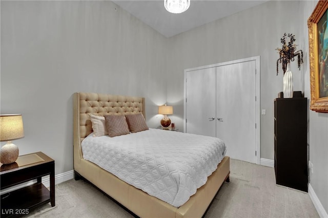 360 E Desert Inn Rd Unit 1803, Las Vegas, NV 89109 - bedroom with light carpet, baseboards, and a closet