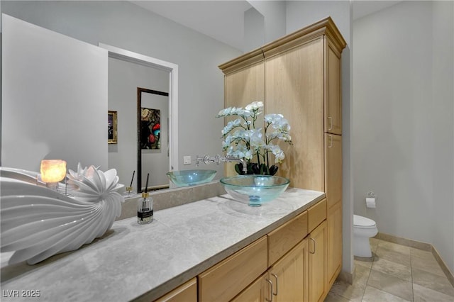 360 E Desert Inn Rd Unit 1803, Las Vegas, NV 89109 - bathroom featuring vanity, toilet, and baseboards