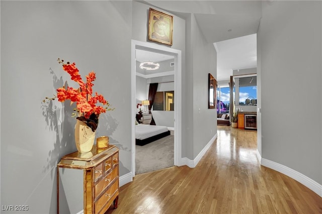 360 E Desert Inn Rd Unit 1803, Las Vegas, NV 89109 - corridor with light wood-type flooring, baseboards, and beverage cooler