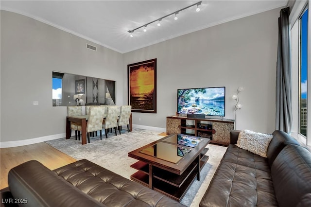 360 E Desert Inn Rd Unit 1803, Las Vegas, NV 89109 - living area with wood finished floors, baseboards, crown molding, and track lighting