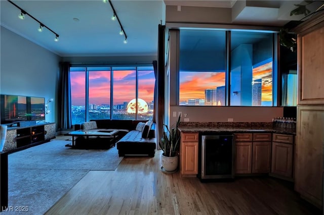 360 E Desert Inn Rd Unit 1803, Las Vegas, NV 89109 - living area with beverage cooler, wood finished floors, rail lighting, and ornamental molding