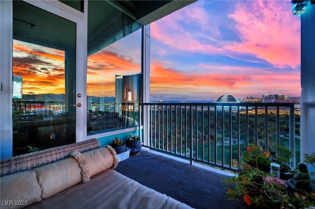 360 E Desert Inn Rd Unit 1803, Las Vegas, NV 89109 - balcony at dusk with outdoor lounge area and a view of city