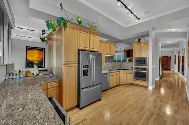 360 E Desert Inn Rd Unit 1803, Las Vegas, NV 89109 - kitchen with appliances with stainless steel finishes, rail lighting, light brown cabinets, light stone countertops, and ornamental molding