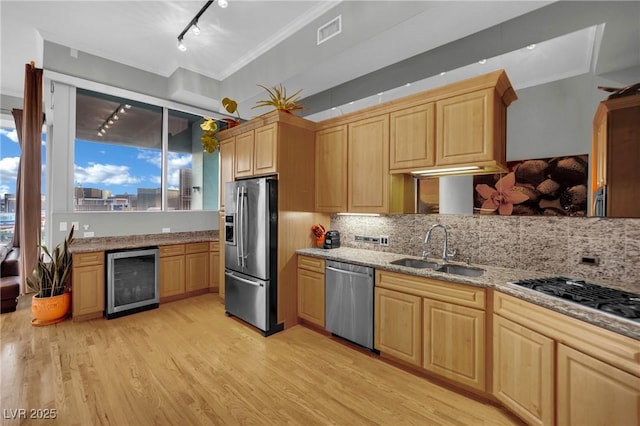 360 E Desert Inn Rd Unit 1803, Las Vegas, NV 89109 - kitchen featuring appliances with stainless steel finishes, wine cooler, light brown cabinets, a sink, and ornamental molding