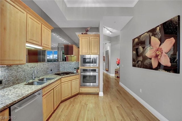 360 E Desert Inn Rd Unit 1803, Las Vegas, NV 89109 - kitchen with appliances with stainless steel finishes, light brown cabinets, a sink, and backsplash
